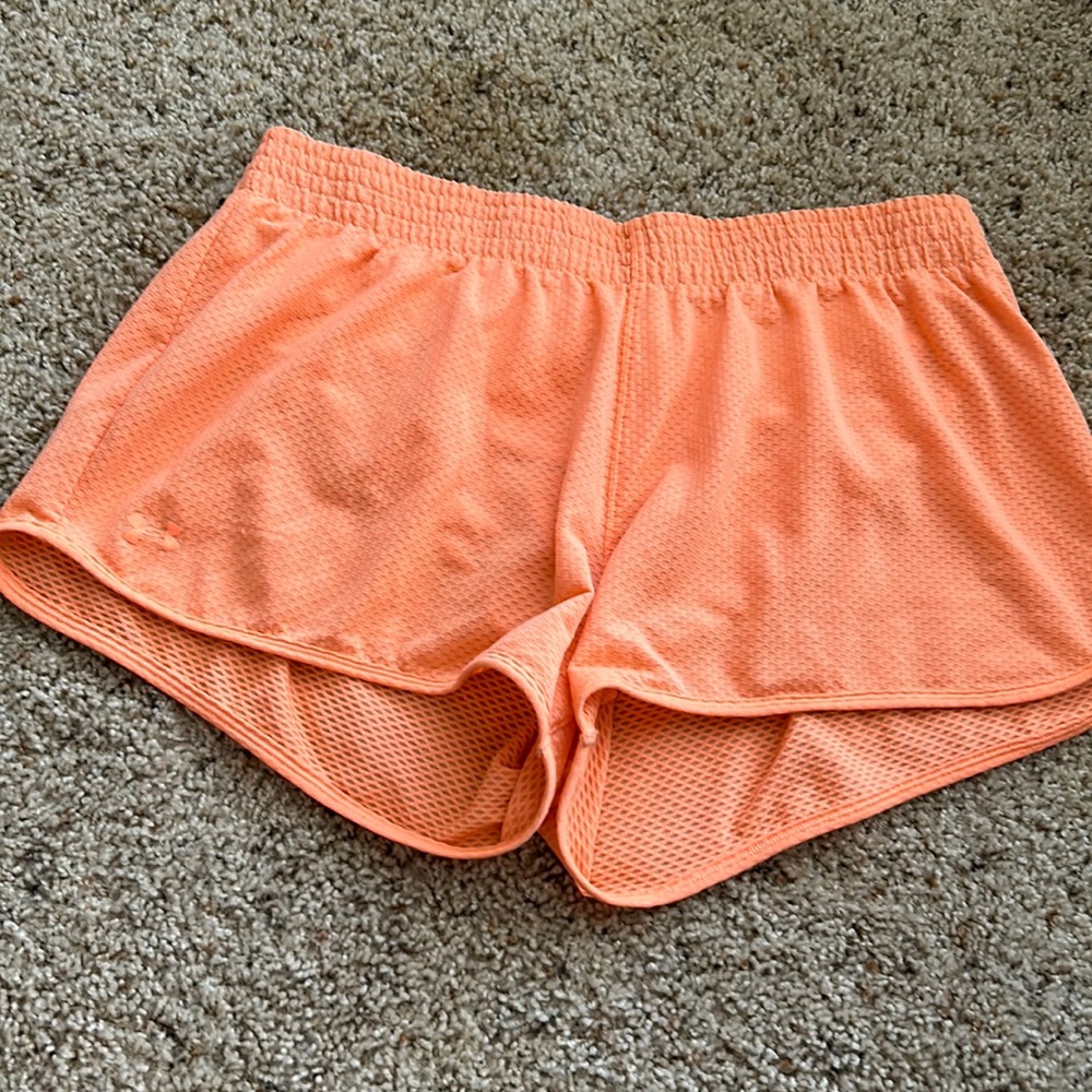 UA bright orange shorts